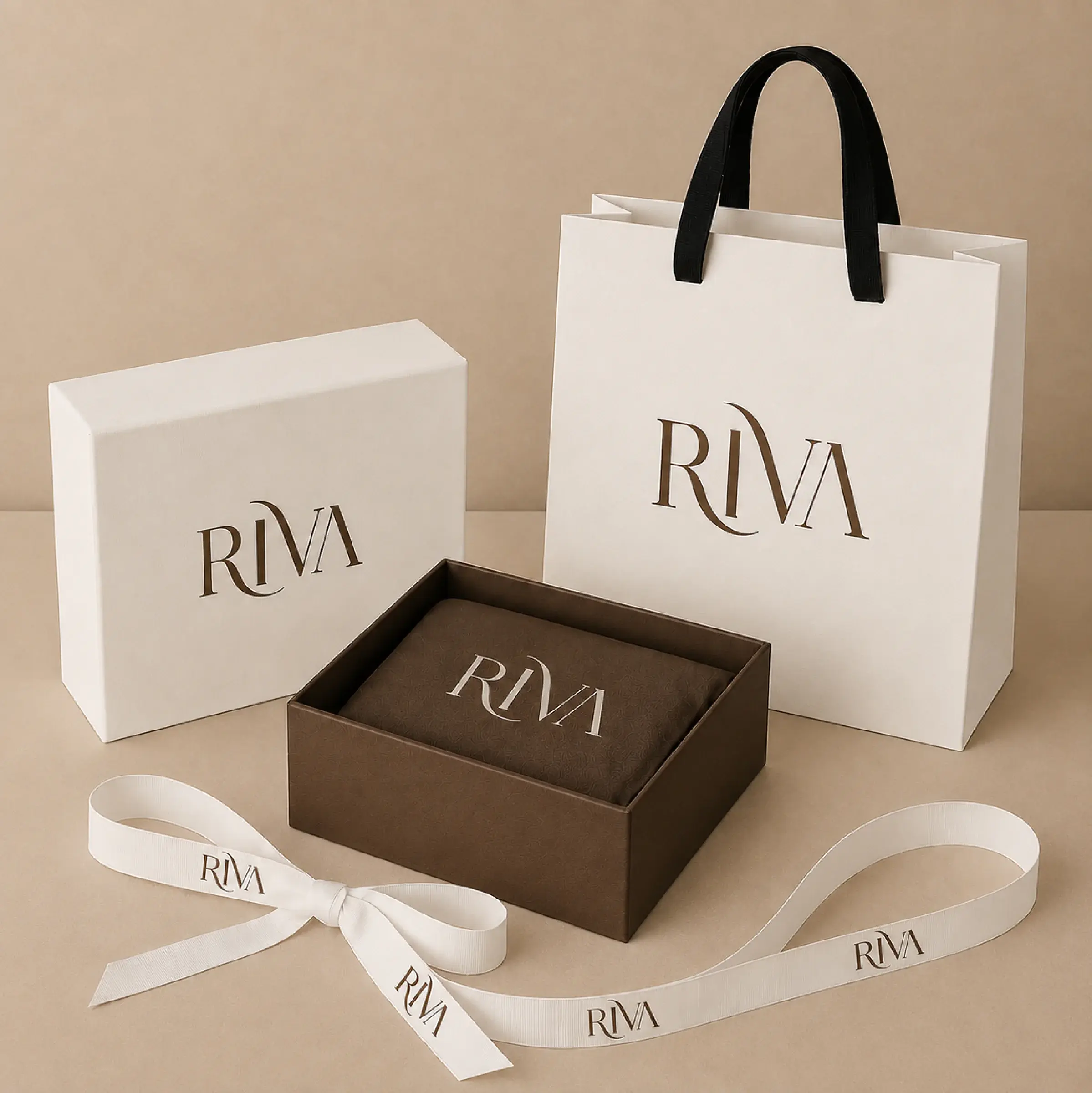 RIVA shopping bag, product box and branded ribbon arranged in warm ivory and brown.